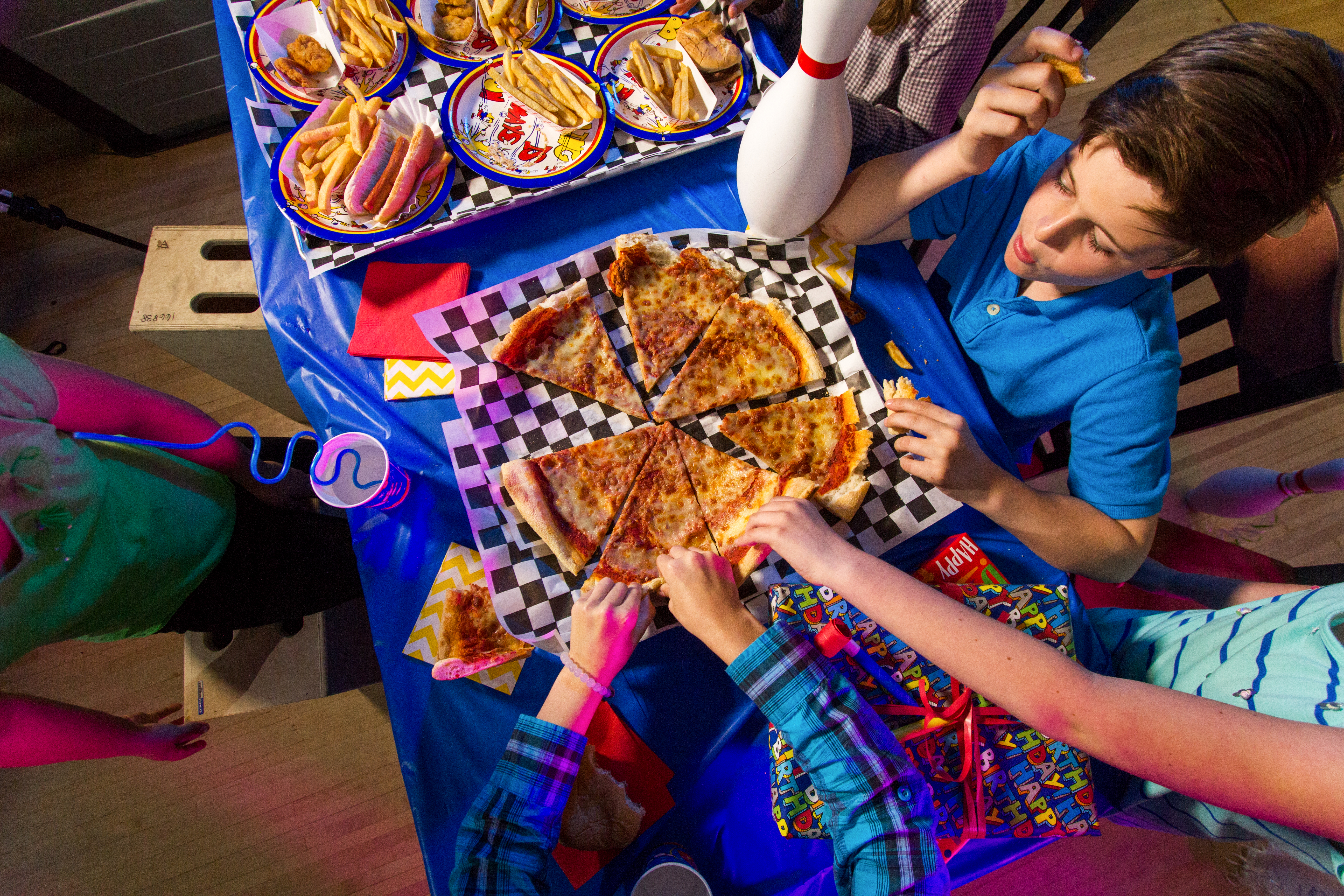 Kid's enjoying a pizza